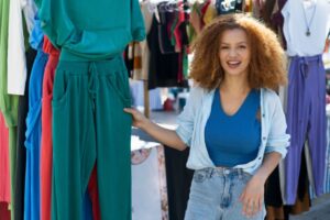 Women facing camera selling clothes