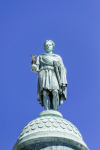Closeup of Vendome column with statue of Napoleon Bonaparte