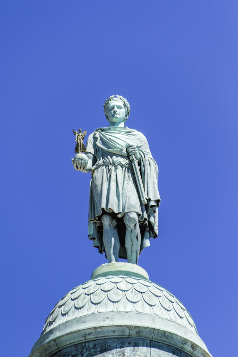 Closeup of Vendome column with statue of Napoleon Bonaparte