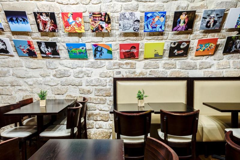 Common Area with chairs and tables at Absolute Paris Hostel