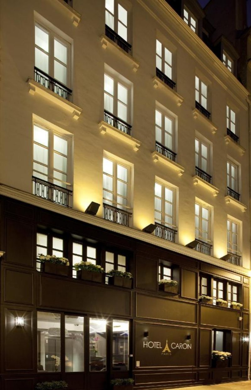 Hôtel Caron Building at Night