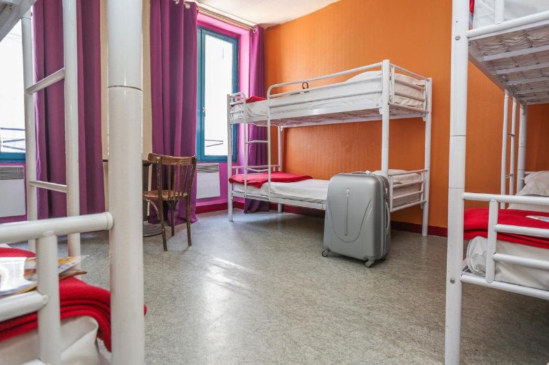 Young and Happy Hostel Room with Bunk Beds