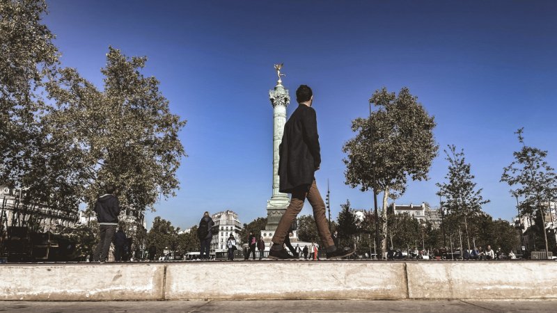 Man Walking at Place de la Bastille