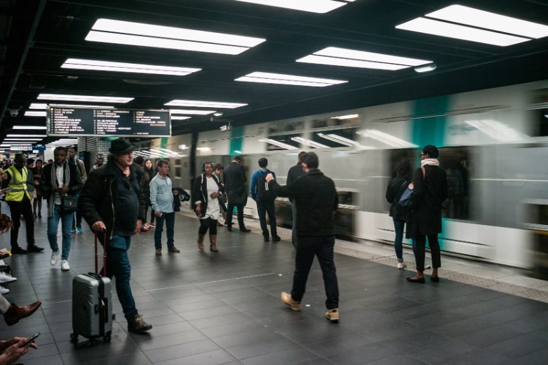 Passengers waiting to get on the surburban RER trains