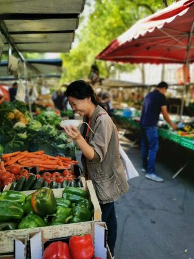 Women buying vegetables from a market