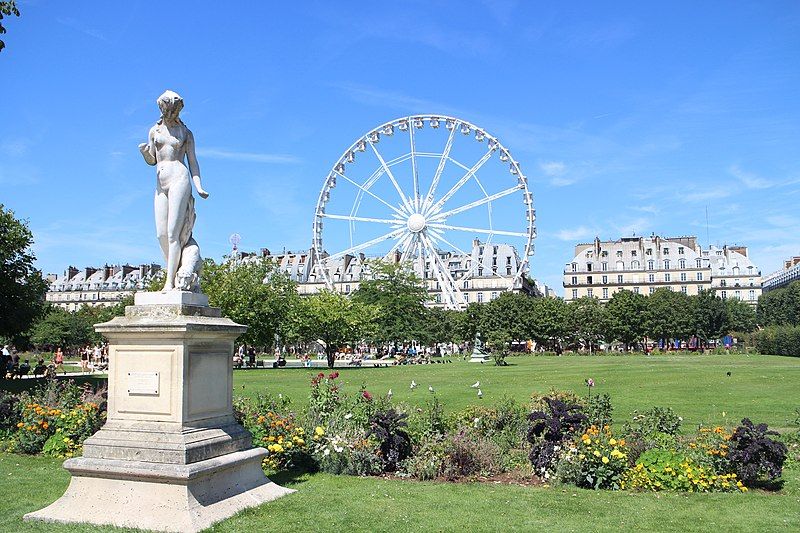 Tuileries Garden with a huge Ferris wheel in the background