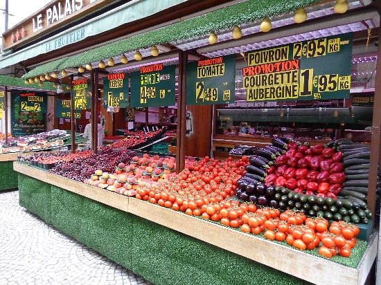 The street features an array of markets, offering a diverse selection of high-quality products, from fresh produce and seafood to various cheeses.