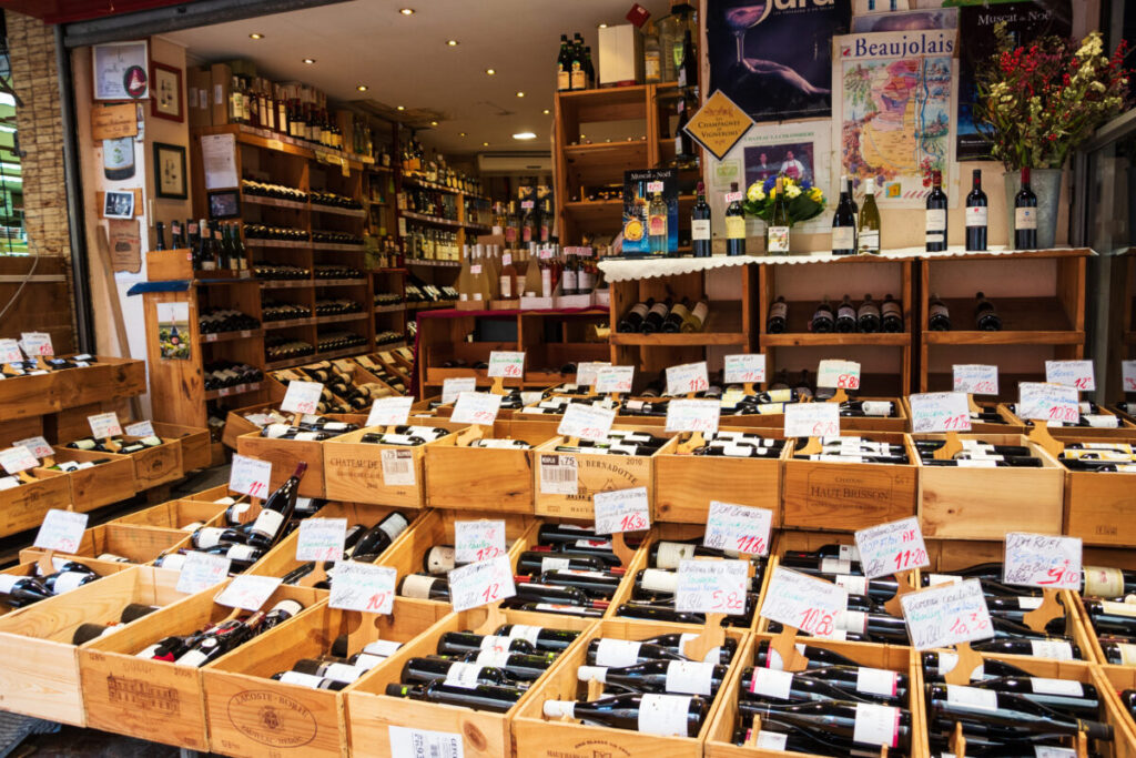 At the entry to La Fontaine aux Vins wine shop at famous Mouffetard street in Latin Quarter