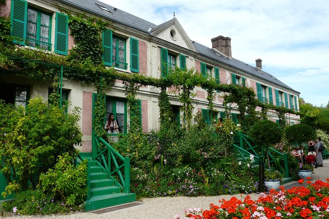 Giverny and Versailles Small Group Day Trip from Paris with a vibrant view of the house