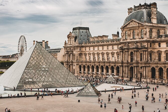 Louvre Museum Skip-the-line Ticket & Seine River Cruise featuring the Parisian architecture.