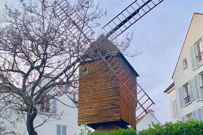 Montmartre Tour Paris with a windmill.