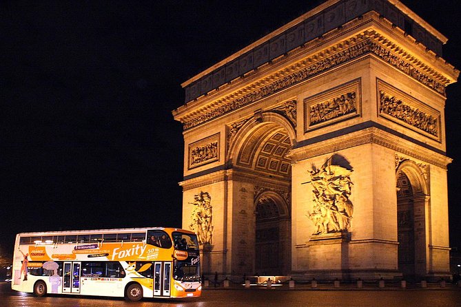 Paris by Night Sightseeing Tour with a view of the Arc de Triomphe.