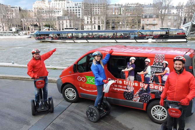 Paris Segway Tour with Ticket for Seine River Cruise with tourists enjoying the ride.