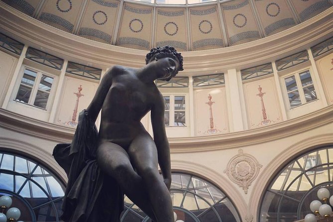 Private Covered Passages & Palais Royal Gardens 2-Hour Tour features intrinsic statue.