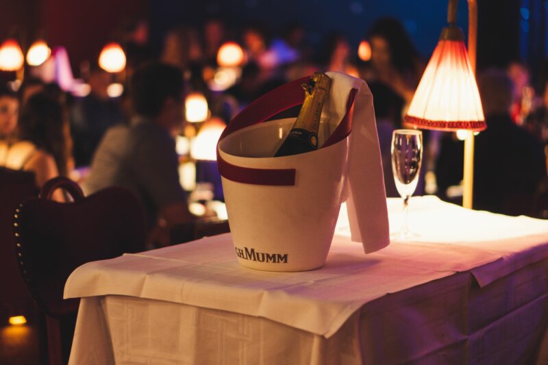 A prepared table with champagne in La Nouvelle Eve, with no guests yet present.