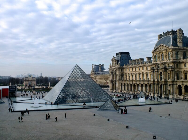 Main Glass Pyramid surrounded by smaller glass pyramids, Louvre Museum, Paris, France