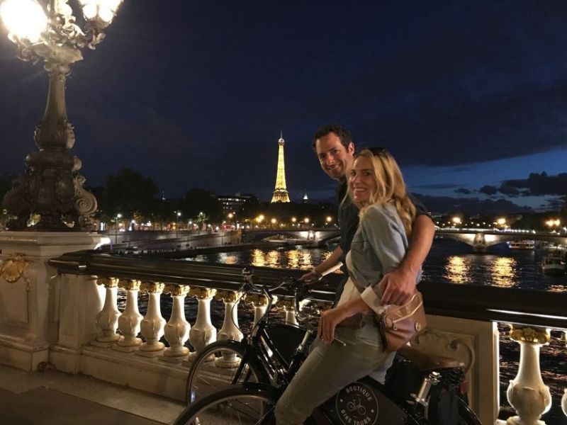 Couple in a Night Bike Tour Overlooking The Eiffel Tower