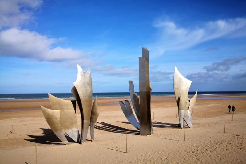 Mémorial Omaha Beach France With A Monument On The Sea