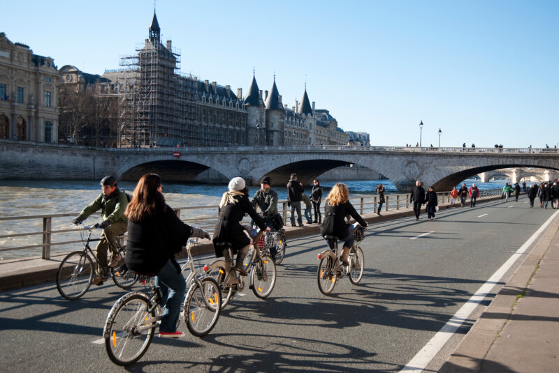 bikers on a sunny day near river bank