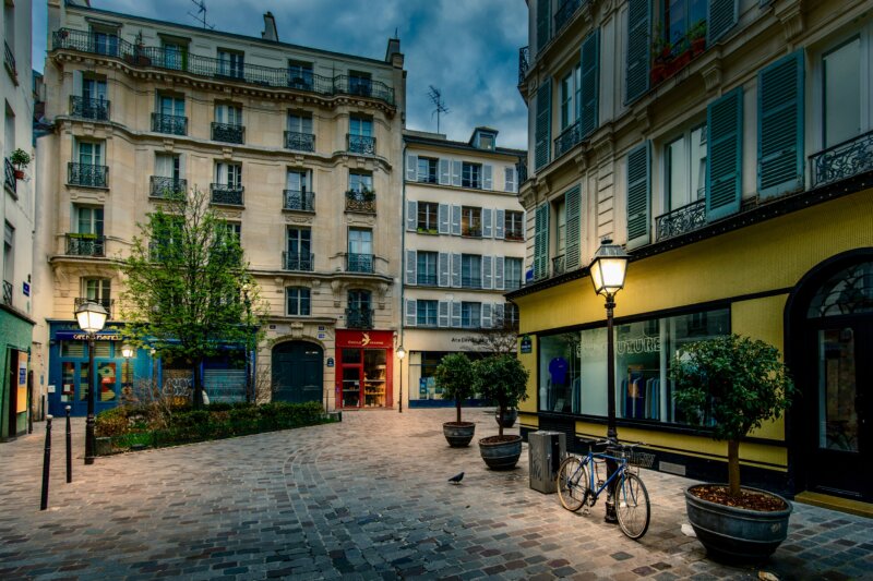 Typical street in Marais district with Rue des Rosiers in Paris