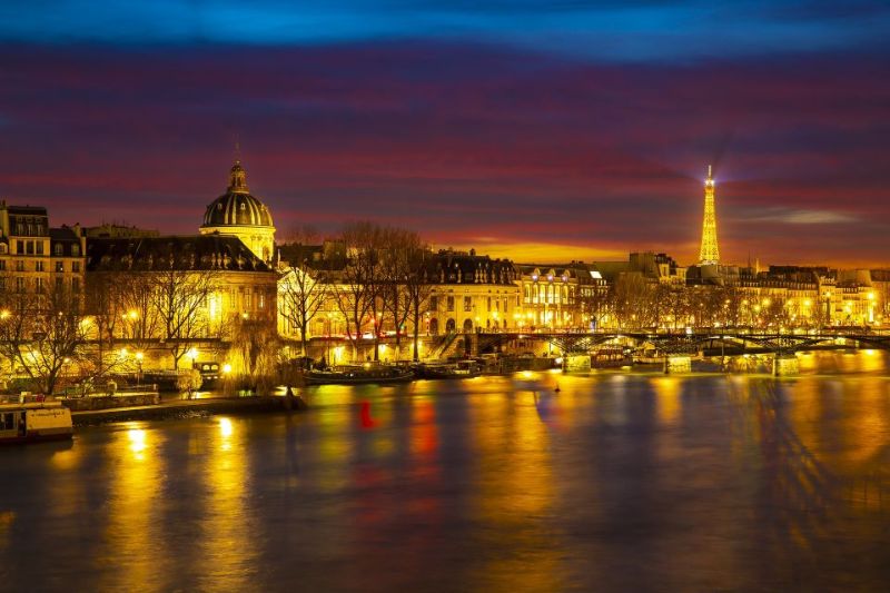 Panoramic night view of the city of Paris and the Eiffel Tower