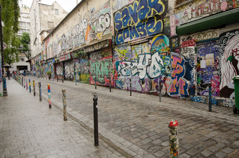 Rue Denoyez, with its abandoned storefronts, has been completely taken over by street artists