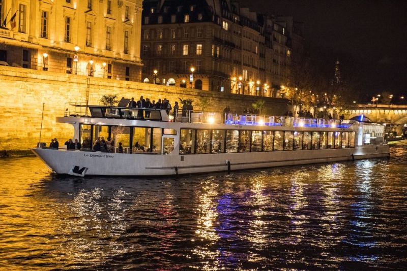 an evening boat tour with people on the open view deck