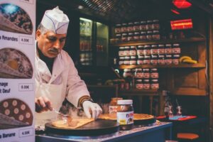 a man making crepes