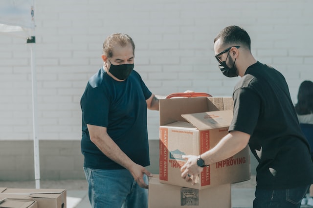 delivery guy giving delivery to customer