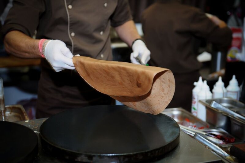 A man making French crepe