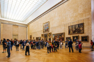 Tourists Visit Art Gallery in Louvre, Paris