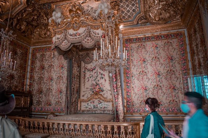 Visitors exploring the interior of the Versailles Palace