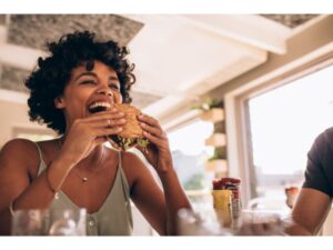 Woman enjoying burger