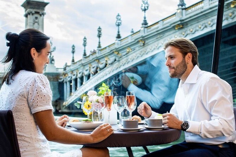 a couple enjoying a lunch in a sightseeing cruise