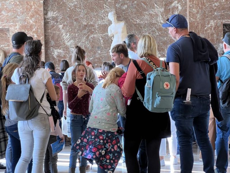 a family on a museum tour with children