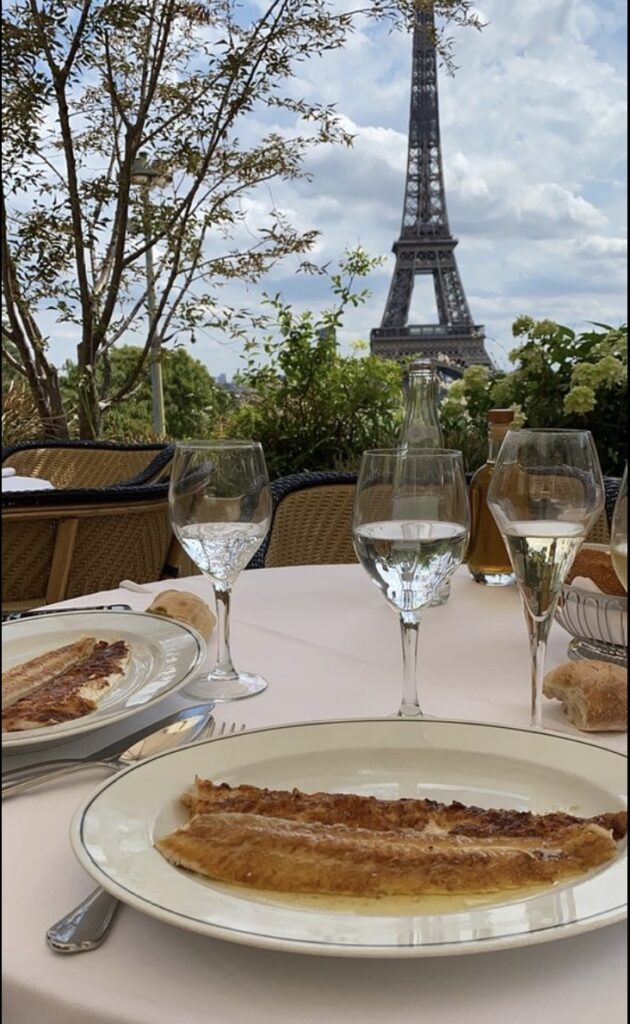 water goblet and meal fronting the eiffel tower at girafe paris