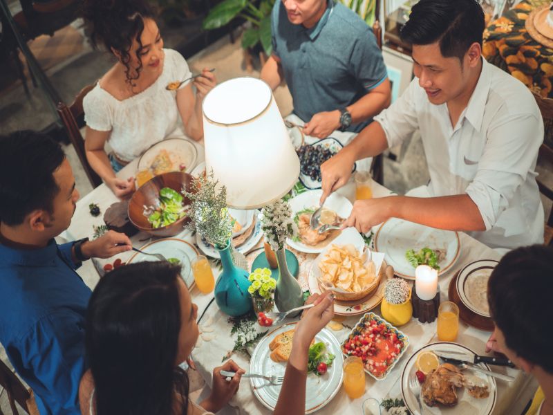 Friends happy eating together