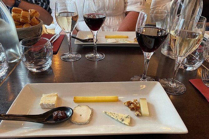 Wine glasses and cheese in Montmarte food tour in Paris