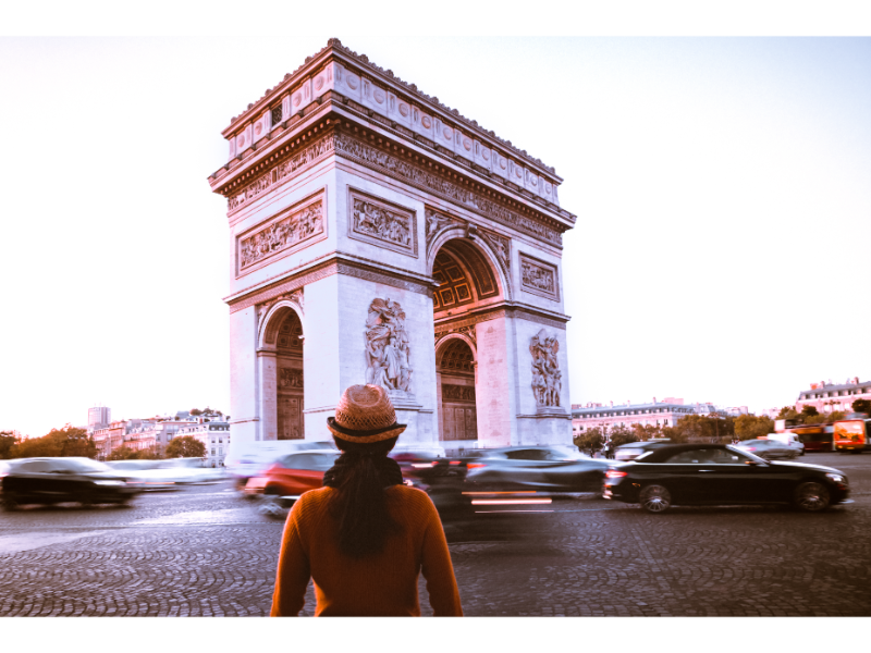 Woman tourist at the Arc de triomphe in Paris