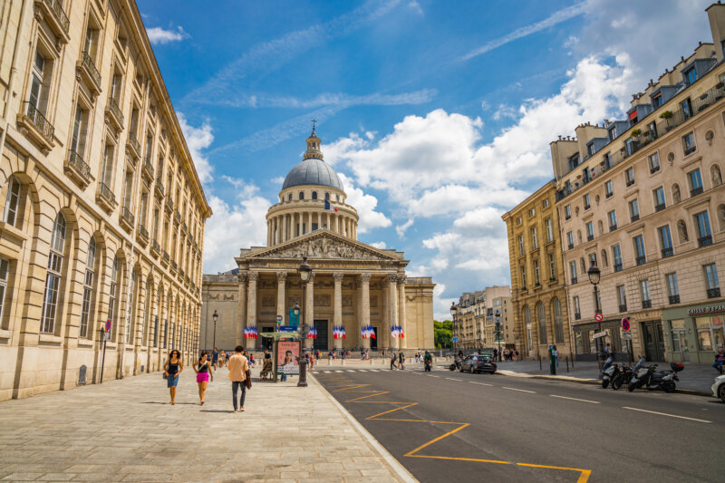 The Pantheon building in the Latin Quarter in Paris France seen from the Rue Soufflot with french flags