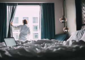 Woman in white robe in a hotel in Paris