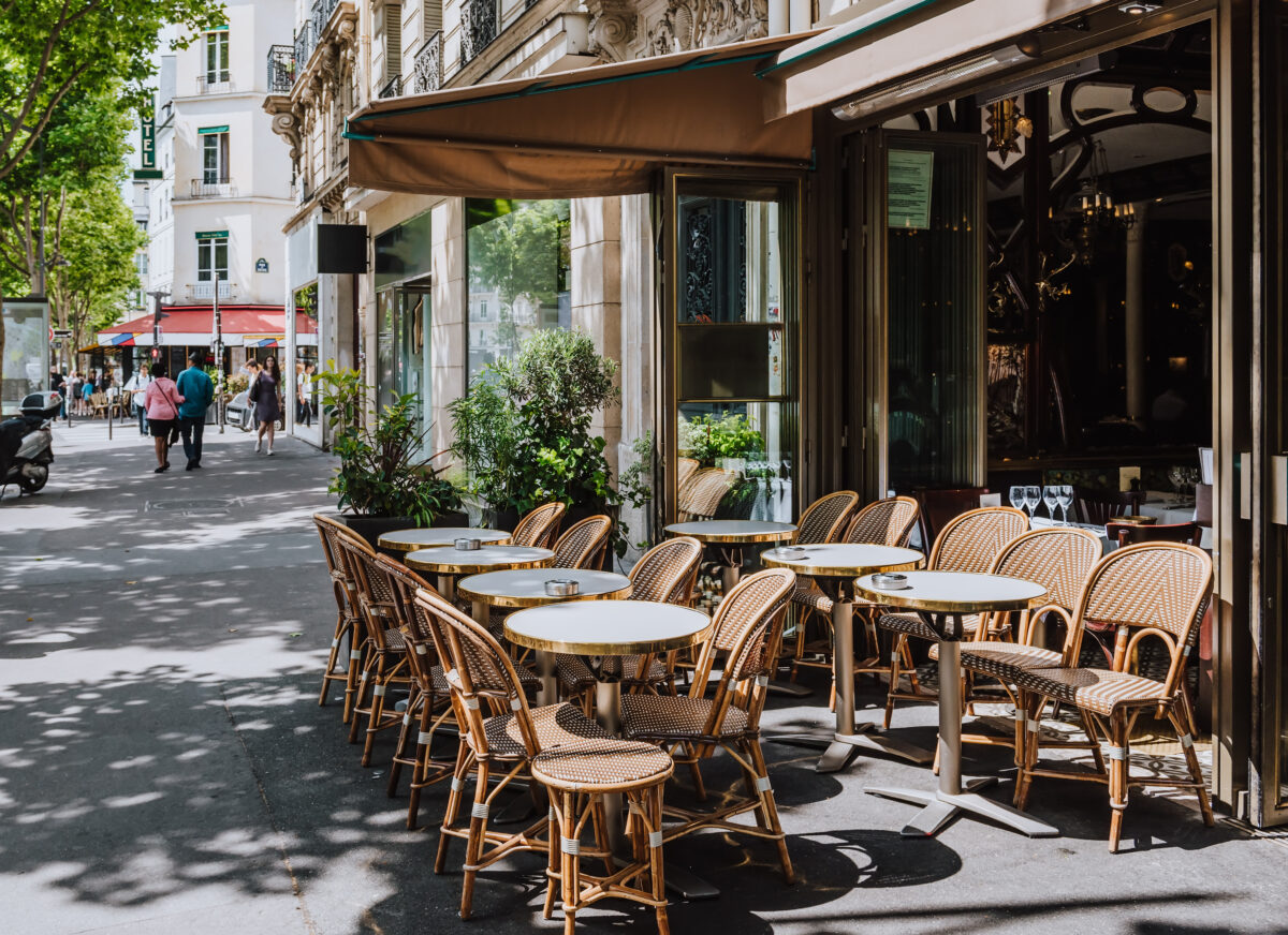 Boulevard San-German with tables of cafe in Paris, France