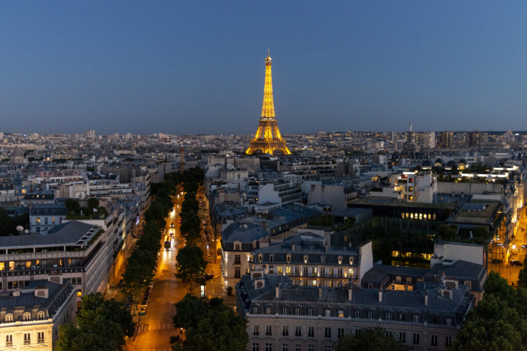 The Eiffel tower by night shot from the Arch of Triumph in Paris, France