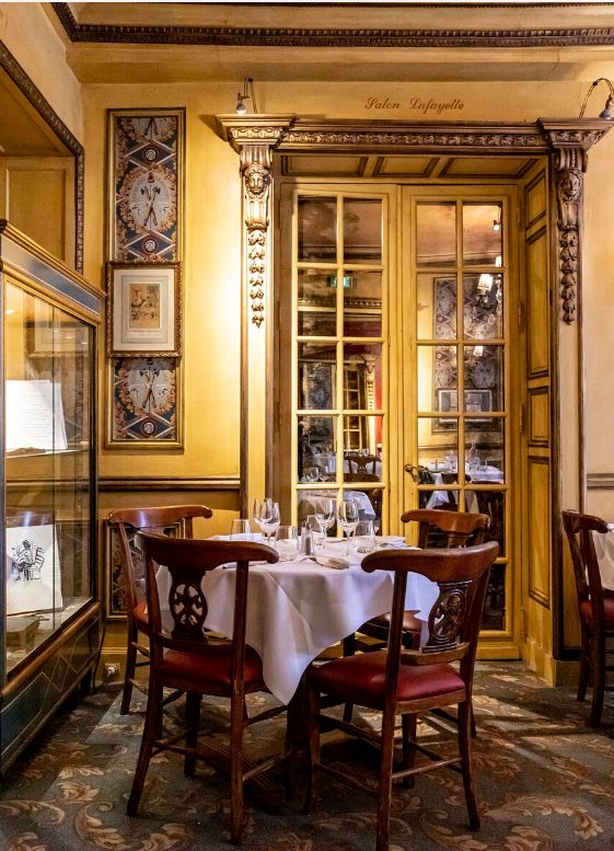 Le Procope, an iconic Parisian restaurant, offers its patrons a comfortable and elegant dining atmosphere.
