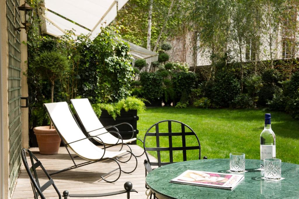 The hotel boasts lovely outdoor spaces, such as a serene garden and a quaint courtyard, offering a peaceful escape from the bustling streets of Paris.