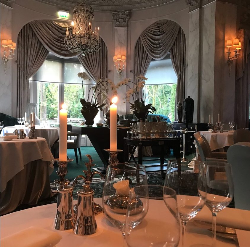 Le Pré Catelan, a renowned restaurant in the Bois de Boulogne in Paris, is known for its remarkable ambiance and exceptional service.