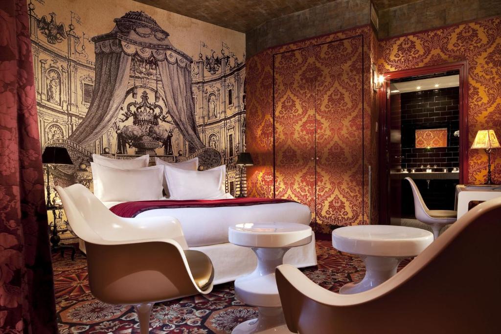 Indulge in the enchanting accommodations of Hôtel du Petit Moulin in Le Marais, Paris.