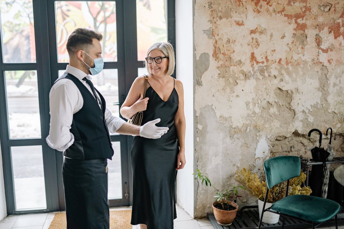 A woman being welcome to a hotel