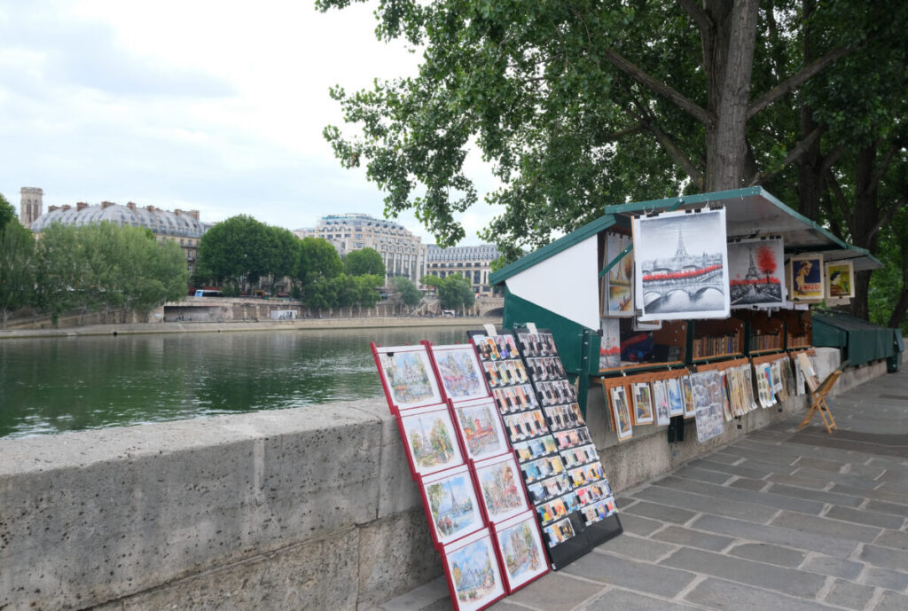 A leisurely stroll along the Seine River offers various treasures - buy a vintage postcard, book, or print from the bouquinistes, vendors who run open-air bookstalls along the riverbank.