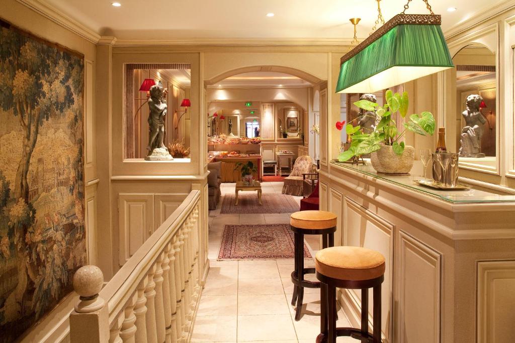 Au Manoir Saint Germain's lobby is a captivating space that transports guests to a bygone era of Parisian elegance.